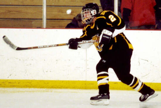 Brendon Benner passes the puck.
