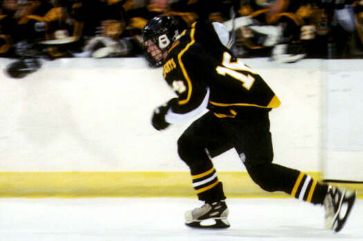 Milton Carter speeds past the Tigers' bench.