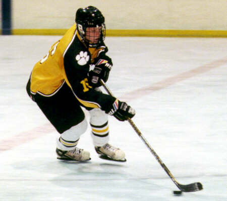 Milton Carter controls the puck.
