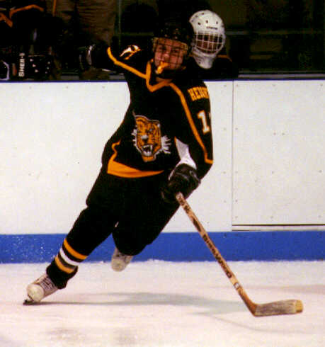 Pat Collins lunges after a loose puck.