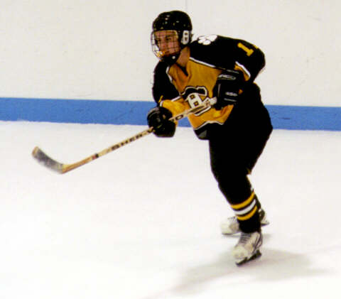 Pat Collins passes the puck.