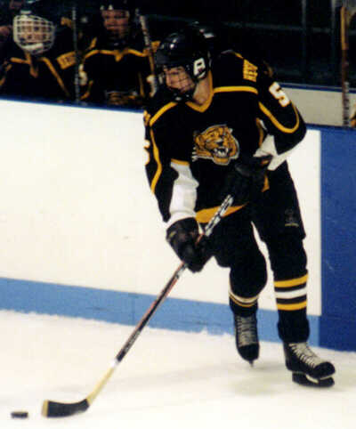 Dan Cross-Call turns the puck up ice.