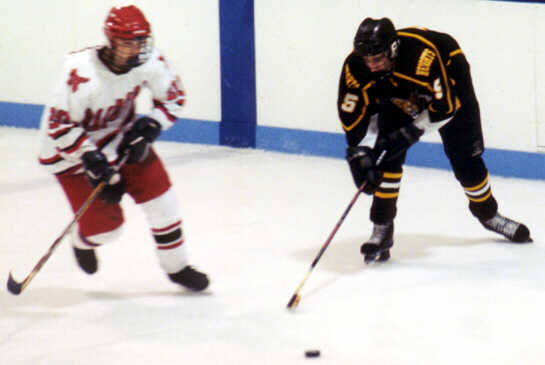 Dan Cross-Call goes after a loose puck.