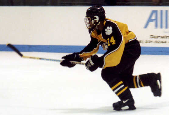 Marcus Dancy races toward the puck.