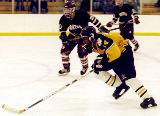 Marcus Dancy skates into Rocky River's zone.