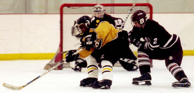 Marcus Dancy drives toward the Rocky River net.