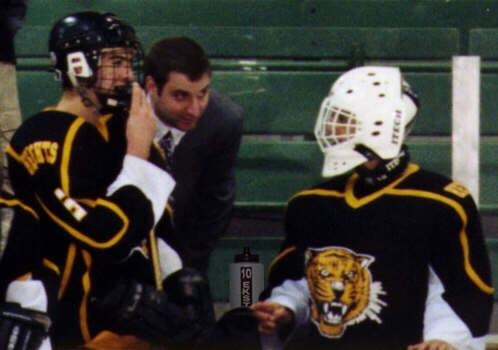 Dan Cross-Call and Ben Gaglioti talk with Head Coach Kirk Guenther.