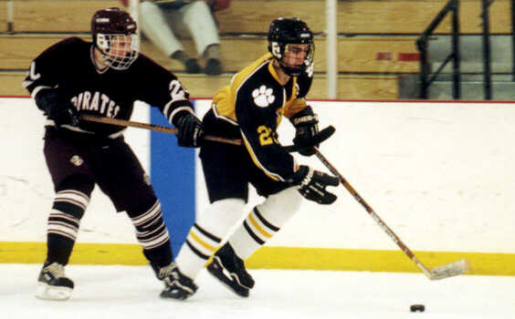 Justin Kalman tows a Pirate through the neutral zone.