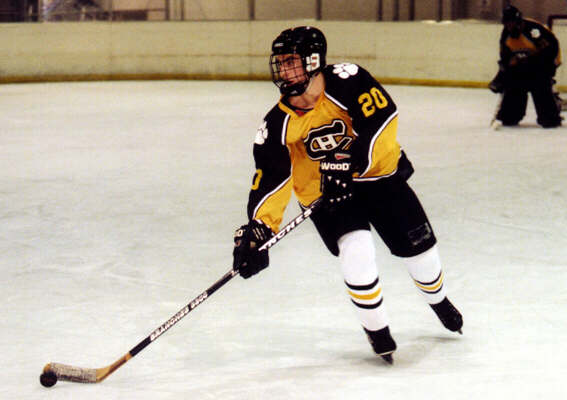 Justin Kalman skates the puck out of the defensive zone.
