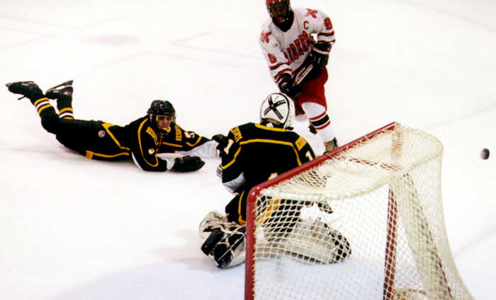 Jared Lavender dives to foil a Shaker scoring chance.