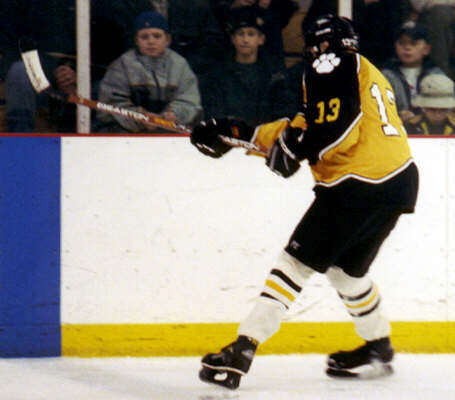 Chris Pesek passes at the blue line.