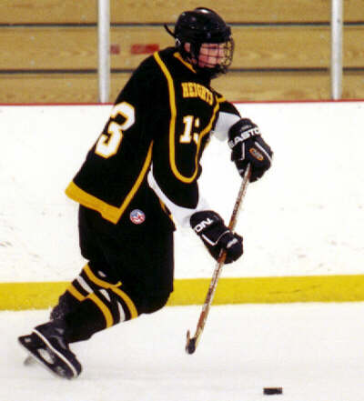 Chris Pesek controls the puck.