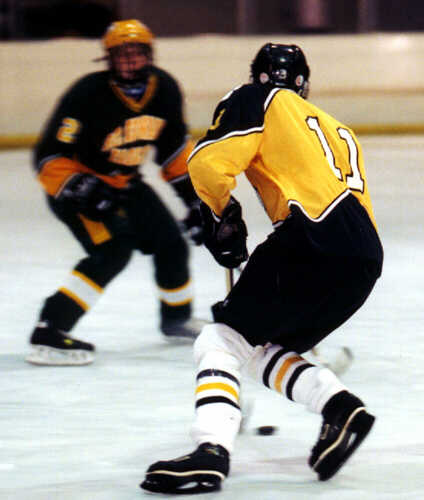 Joe Ross closes in on a St. Edward defenseman.