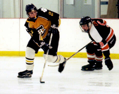 Andrew West eludes a Normandy Invader.