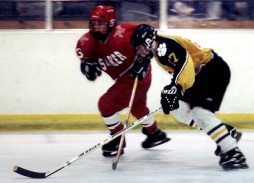 Andrew West skates alongside a Shaker Raider.