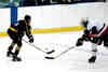 Jeff Houser knocks the puck away from a Padua Bruin.