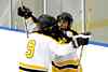 Nate Hall hugs Ben Winger after netting a hat trick against Mentor.