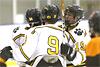Teammates congratulate Ricky Urminski after his first goal.