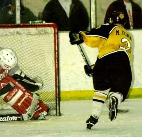 Mike Turner watches a goal