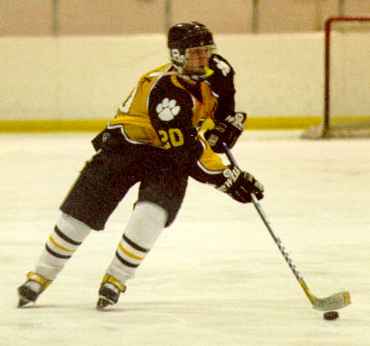 Eddie Babcox skates with the puck