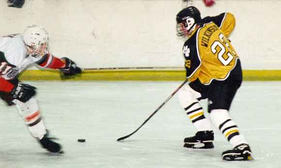 Ryan Wilkinson moves the puck