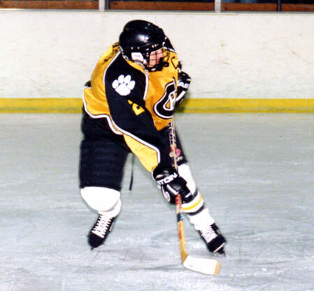 Eric Aber follows the flight of his shot against Erie McDowell.