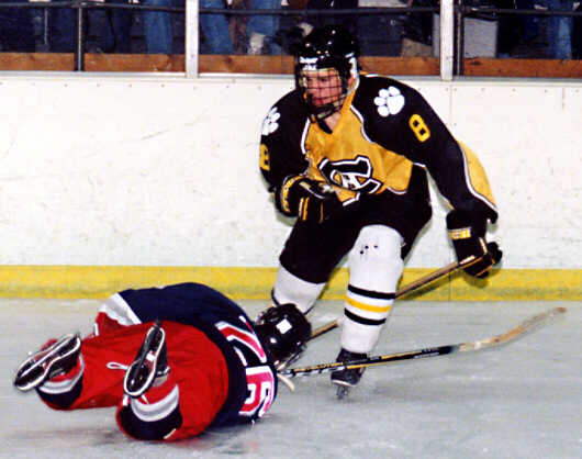 Shannon Barden knocks over an Erie McDowell Trojan.