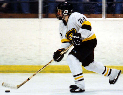 Co-Captain Brian Clark advances the puck.