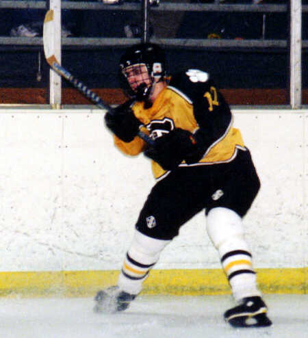 Brendon Benner clears the puck from the defensive zone.