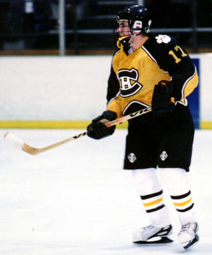 Brendon Benner defends against University.