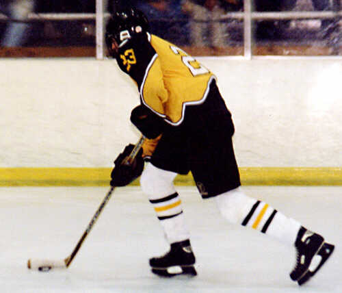 Dan Cross-Call brings the puck through the neutral zone.