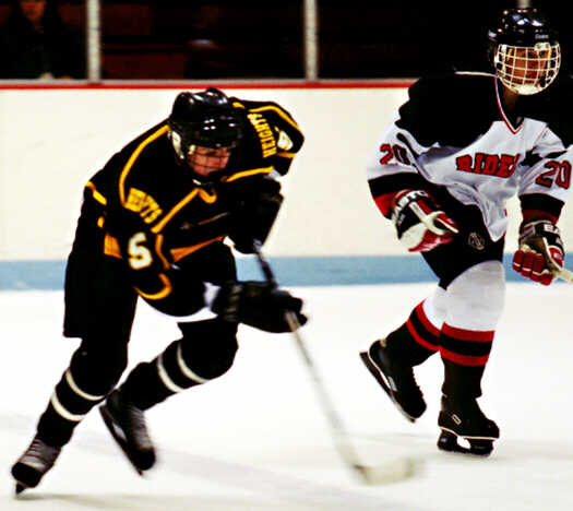 Dan Cross-Call races toward the puck.