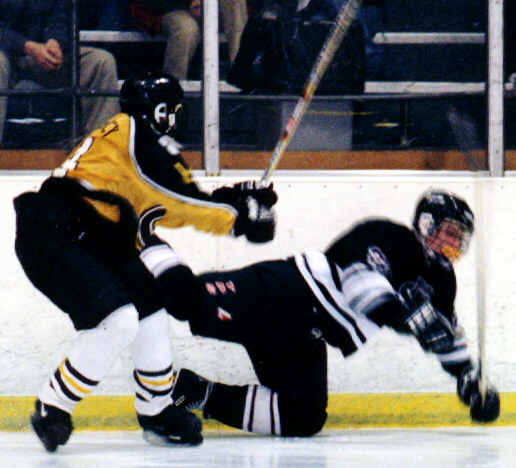 Marcus Dancy tosses a University Prepper to the ice.