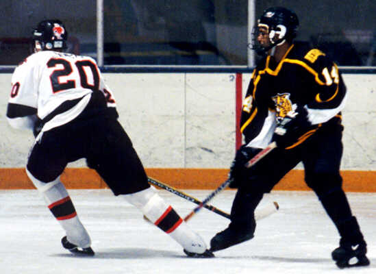 Marcus Dancy crosses paths with a North Olmsted Eagle.