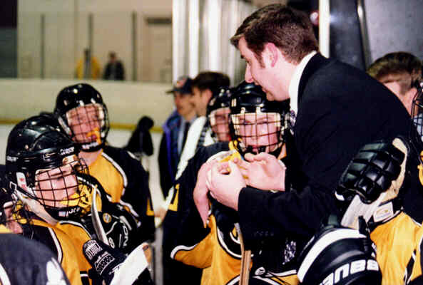 Head Coach Kirk Guenther talks to the team during a time out.