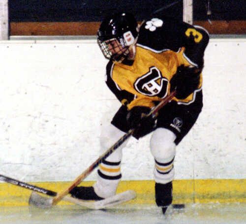 Jared Lavender wins a loose puck along the boards.