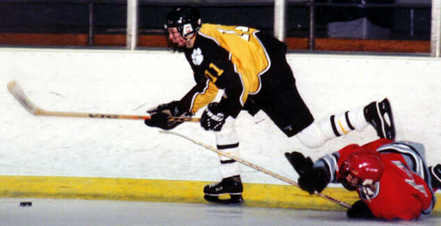 Joe Ross steps over a fallen Mentor Cardinal.