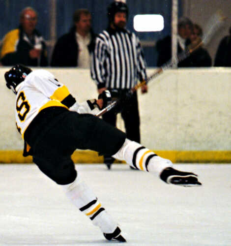 Mike Ruflin flings a shot on net.